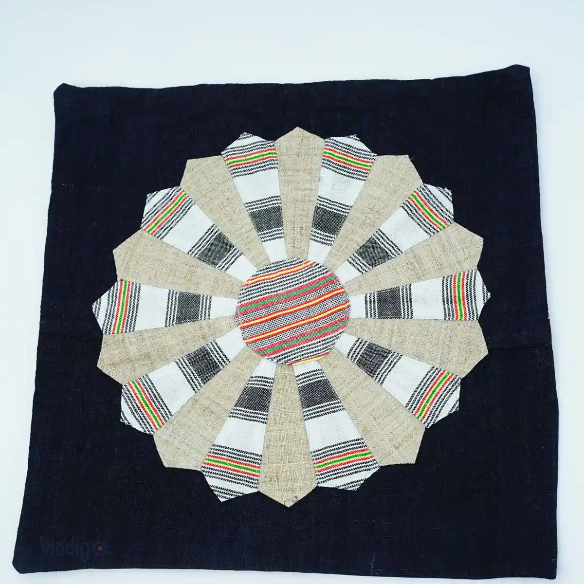 Close-up of hand-quilted Dresden Plate patchwork on indigo cushion