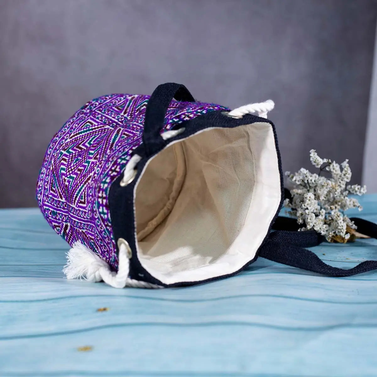 Inside view of Vindigo purple hemp geometric embroidered bucket bag