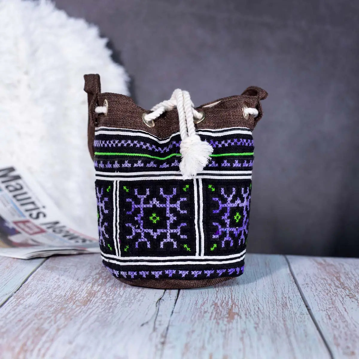 Vindigo brown hemp geometric embroidered bucket bag side angle view