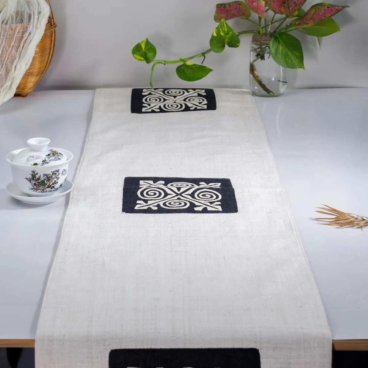 Vindigo beige hemp table runner full top view featuring double embroidered H’mong motifs