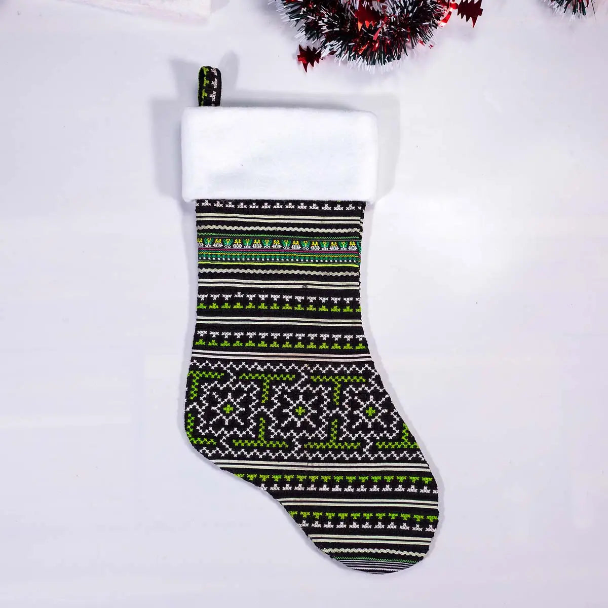 Vindigo green and black geometric embroidered Christmas stocking front angle