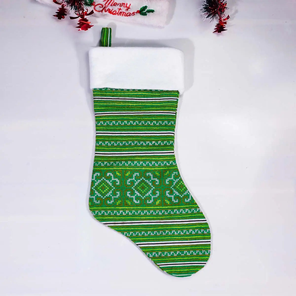 Vindigo green tribal embroidery Christmas stocking with white top front view