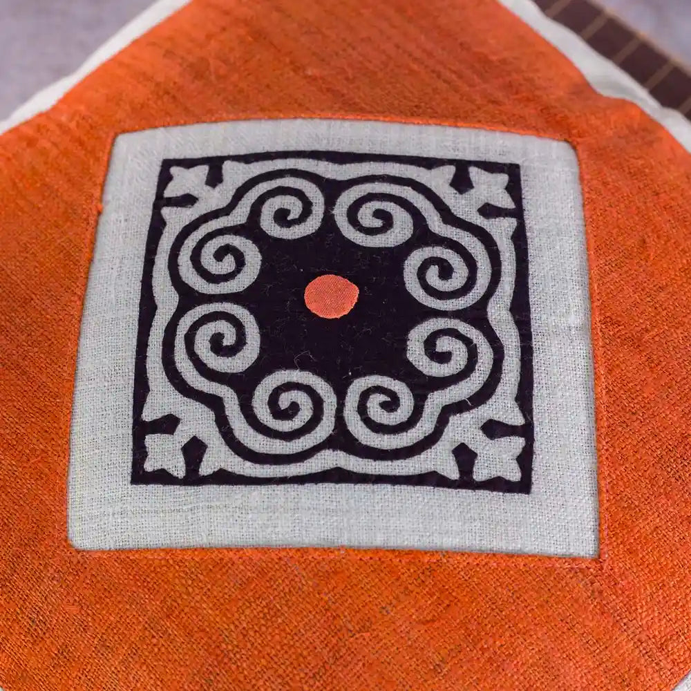 Vindigo orange and white hemp cushion cover with geometric Hmong motif