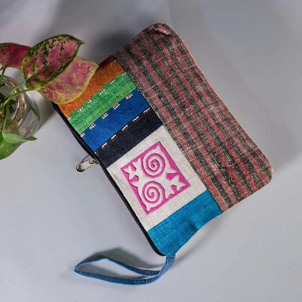 Vindigo hemp cosmetic bag flat lay view showing multicolor woven stripes