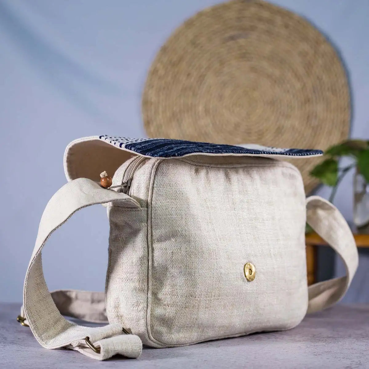 Vindigo beige hemp crossbody bag showing side profile and flap