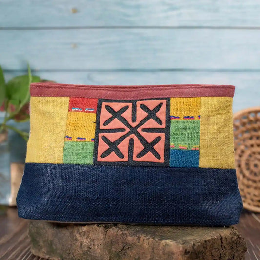 Vindigo multicolor hemp cosmetic bag front close-up showing H’mong embroidery