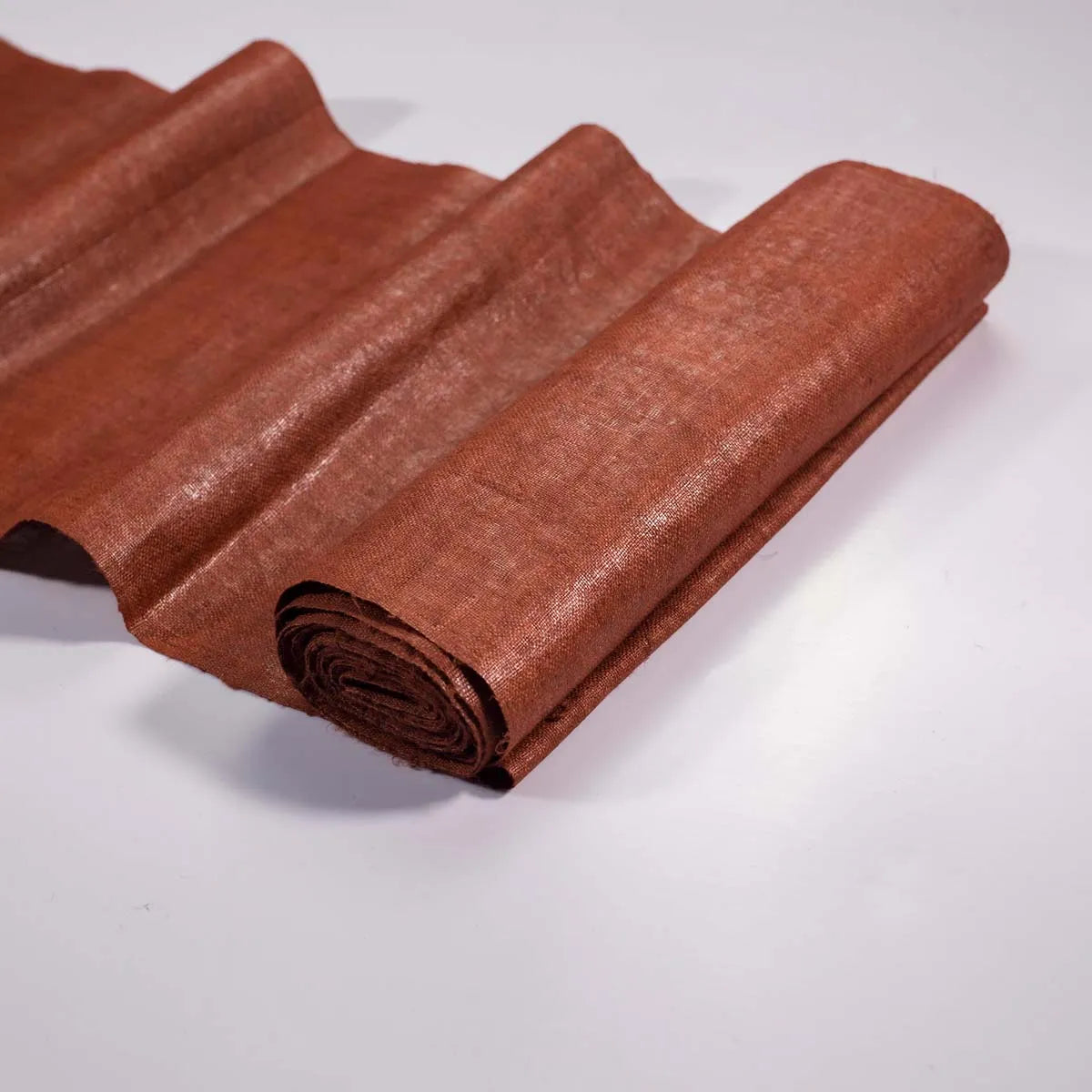 Vindigo orange hemp fabric roll with natural sheen