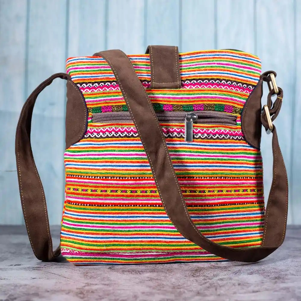 Vindigo hemp crossbody bag back view with striped orange fabric and zipper pocket