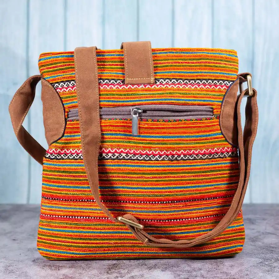 Vindigo orange hemp crossbody bag back view with striped design and zipper pocket