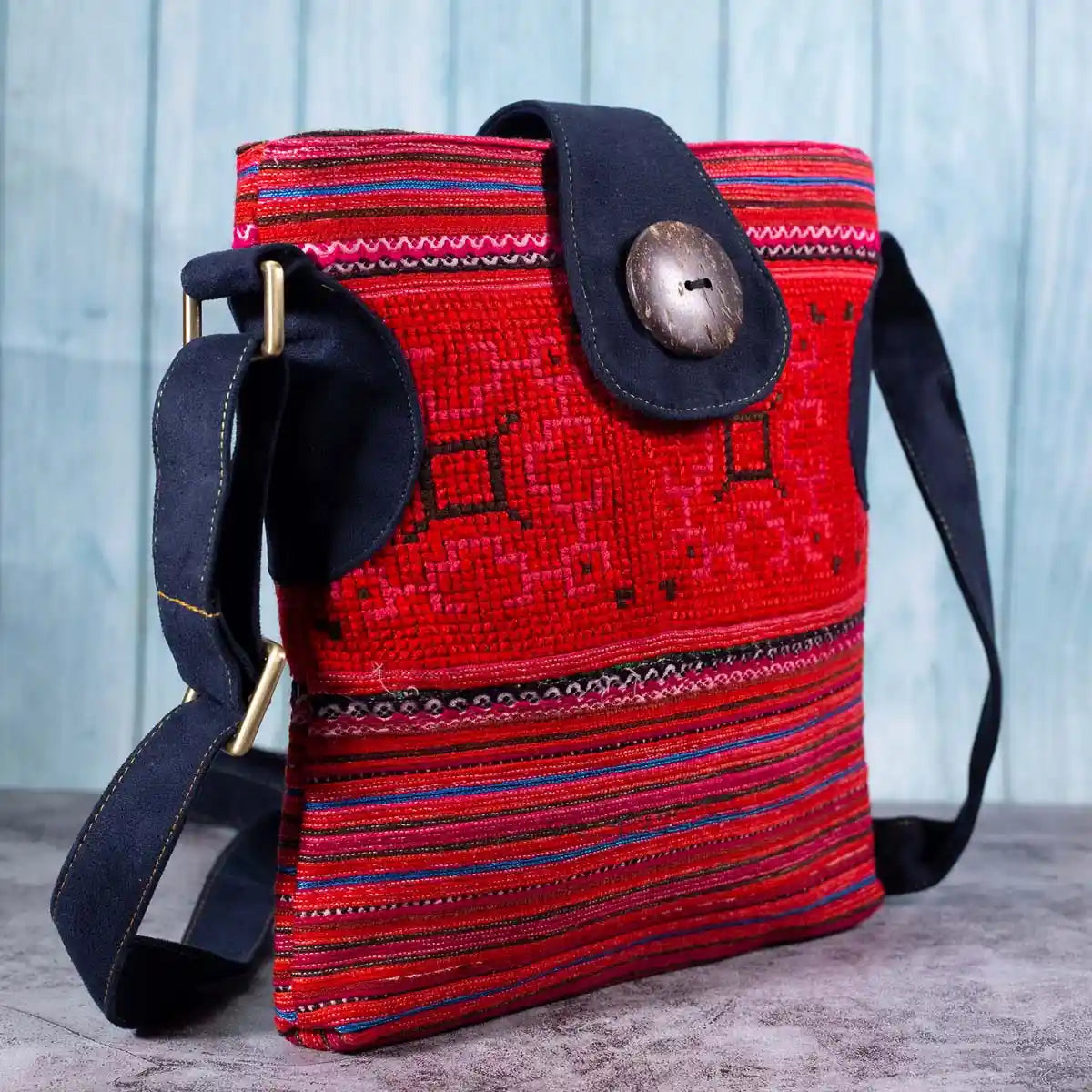 Vindigo red hemp crossbody bag side angle showing textured hand embroidery