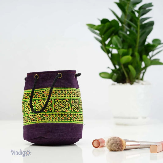 Vindigo purple tribal pouch close-up with green embroidered pattern