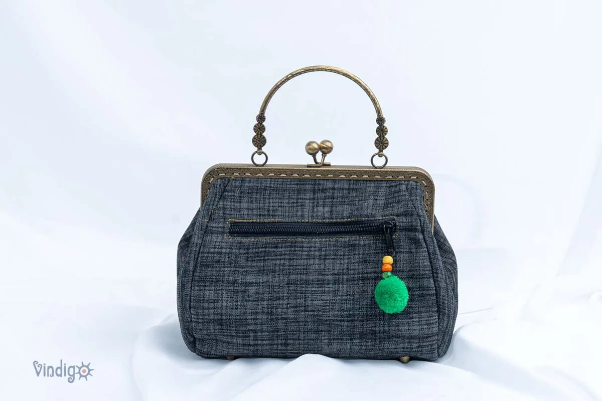 Vindigo black embroidered handbag with green tassel back view