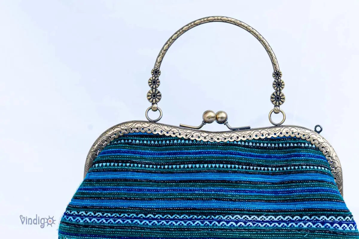 Vindigo close-up of metal frame and blue striped embroidery