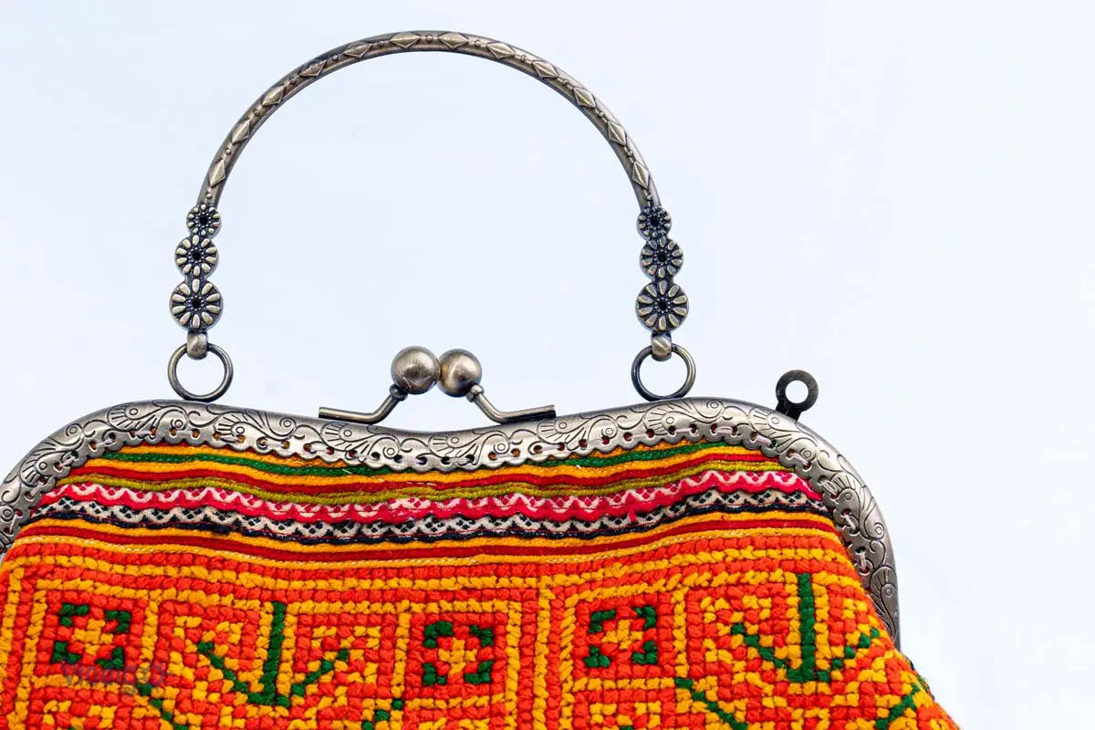 Vindigo handbag copper handle with floral carving close-up