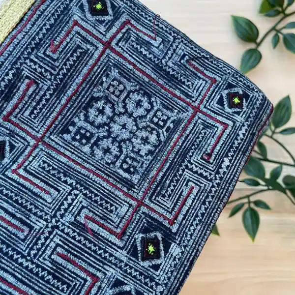 Zoom on central tribal pattern in indigo blue hemp