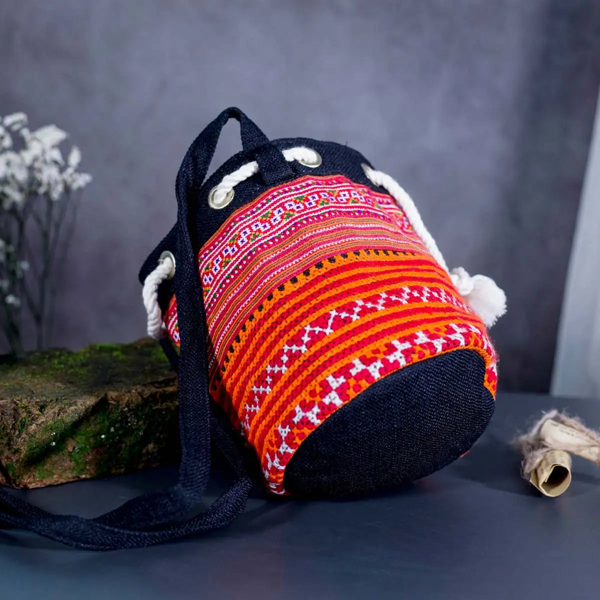 Bottom view of Vindigo orange hemp tribal embroidered bucket bag