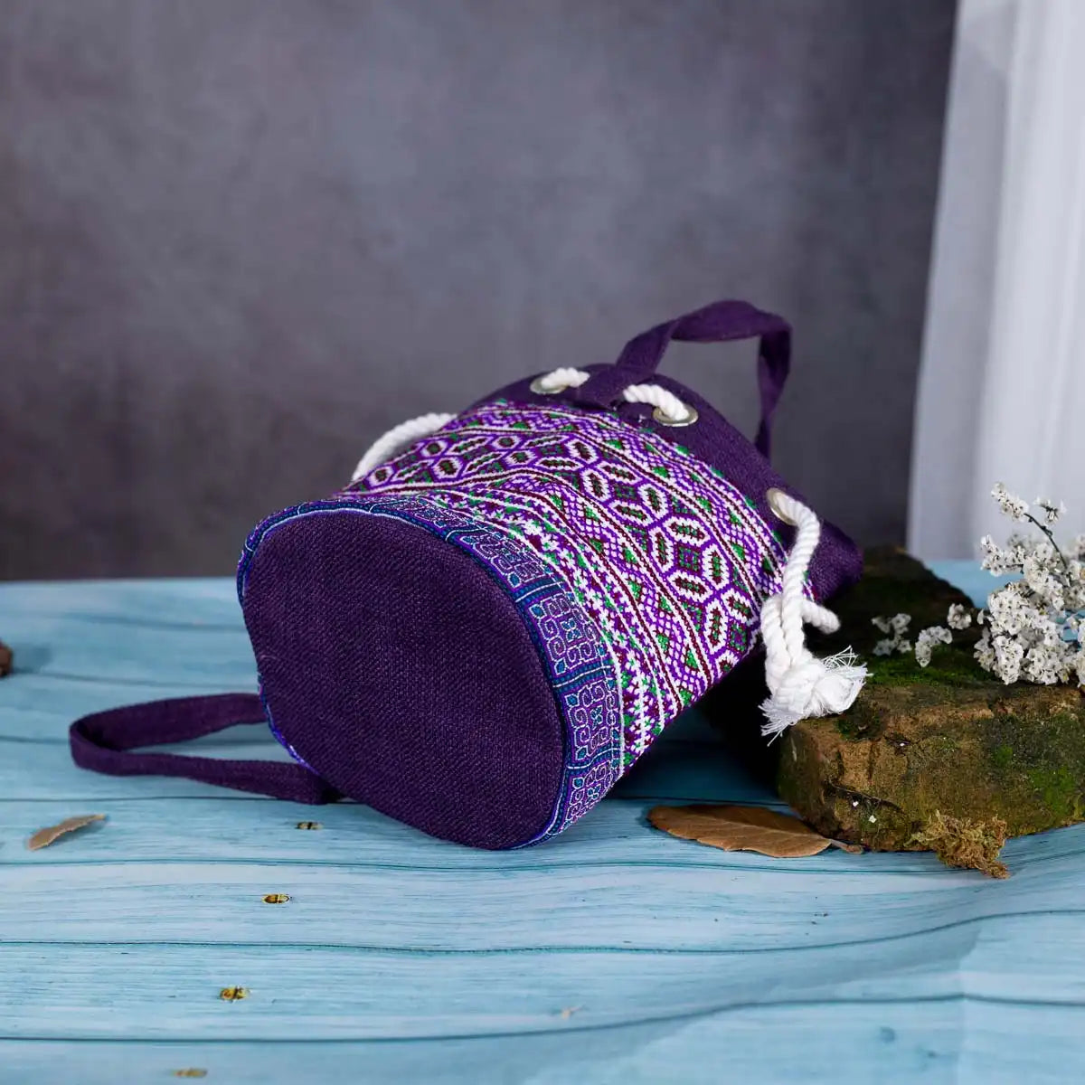 Vindigo purple embroidered canvas bucket bag bottom angle view