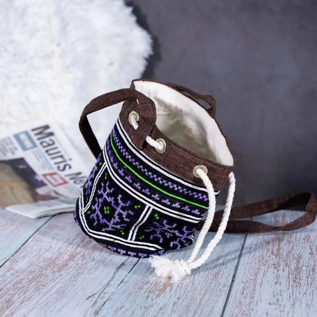 Inside view of Vindigo brown hemp geometric embroidered bucket bag