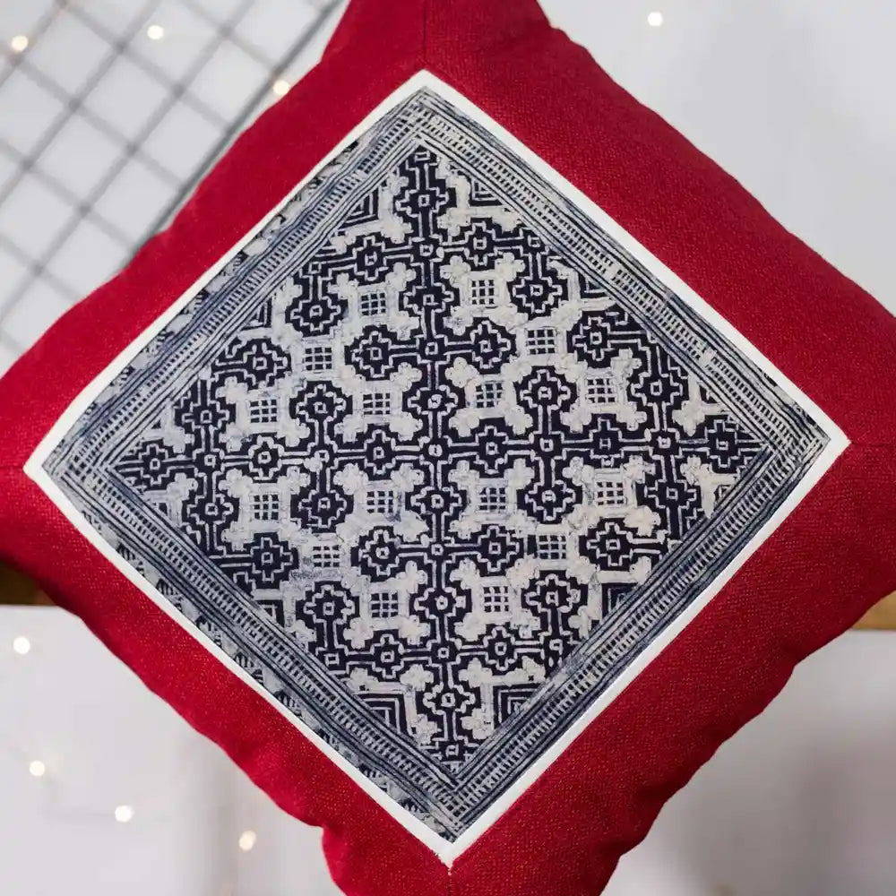 Vindigo red cushion cover close-up highlighting intricate H’mong batik handwork
