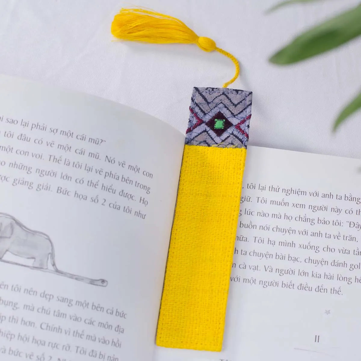 Vindigo yellow hemp batik pattern bookmark side angle on book