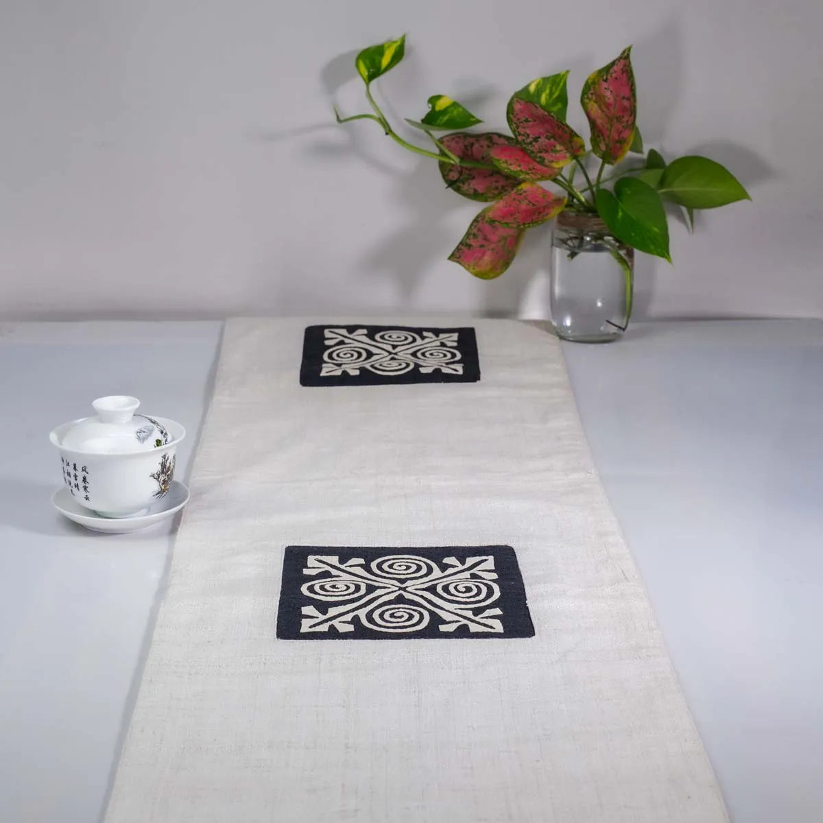Vindigo beige hemp table runner full view showing two central embroidered motifs