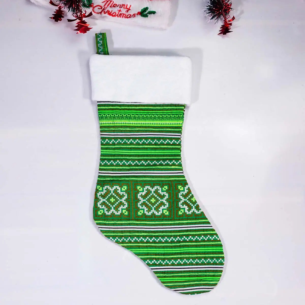 Vindigo green geometric embroidered Christmas stocking front close-up