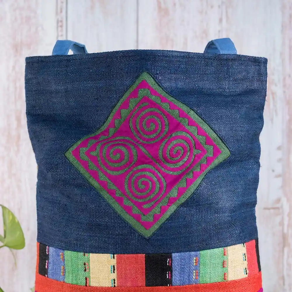 Vindigo shoulder bag indigo hemp hand-embroidered pink spiral patch close-up