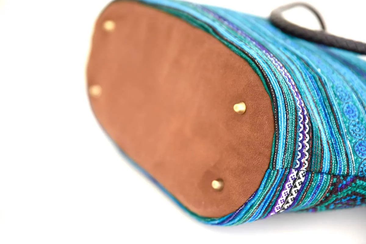 Bottom view showing brown suede base of blue hemp tote