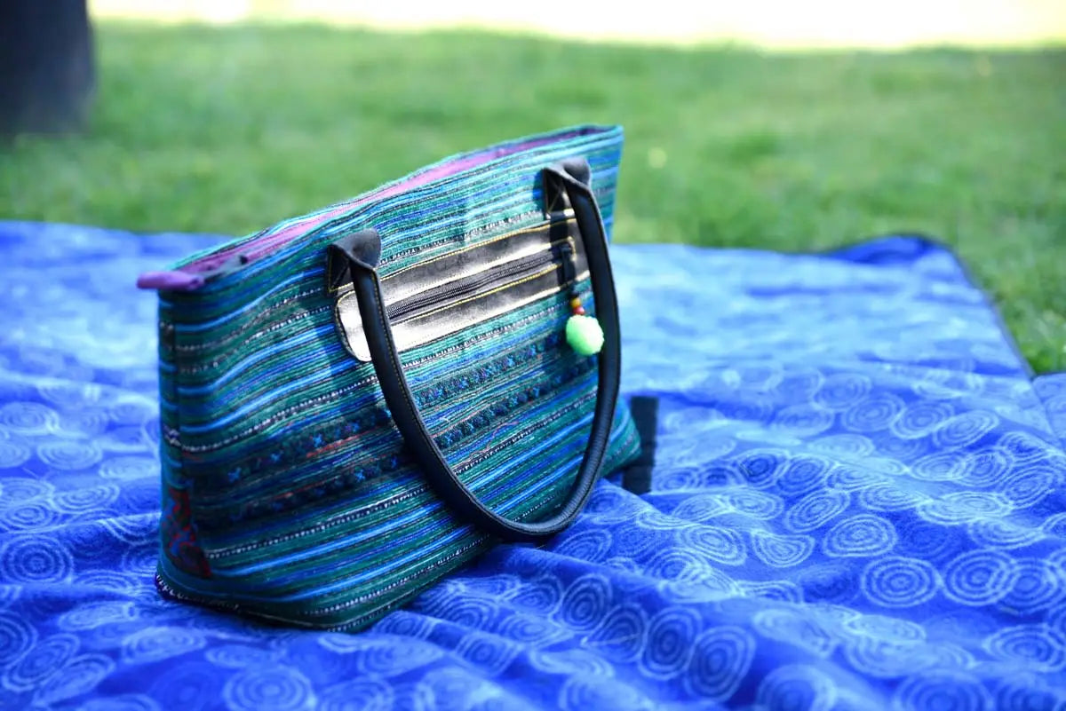 Vindigo tribal hemp tote bag placed on blue outdoor mat