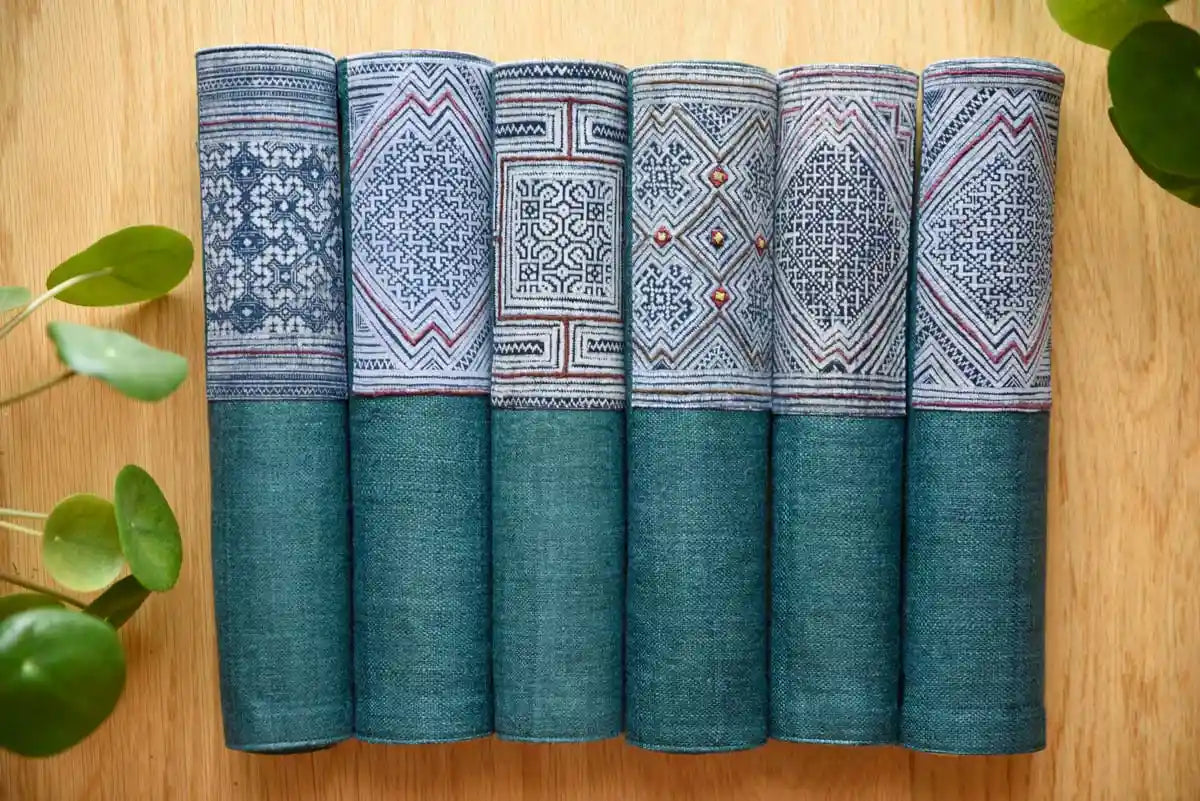 Rolled indigo hemp napkins with tribal geometric fabric pattern