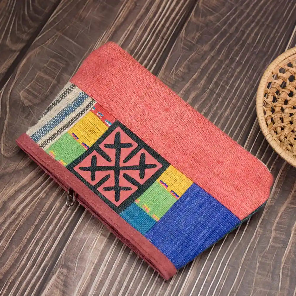 Vindigo hemp cosmetic bag flat lay showing red and multicolor embroidered front