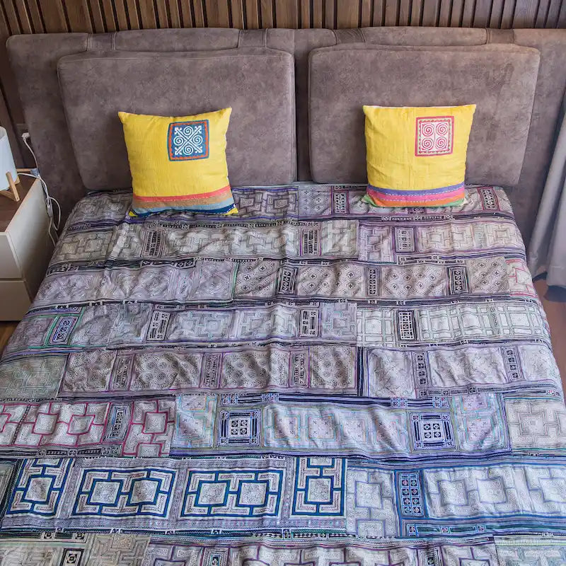 Vindigo Hmong cotton bed cover lifestyle scene with yellow cushions
