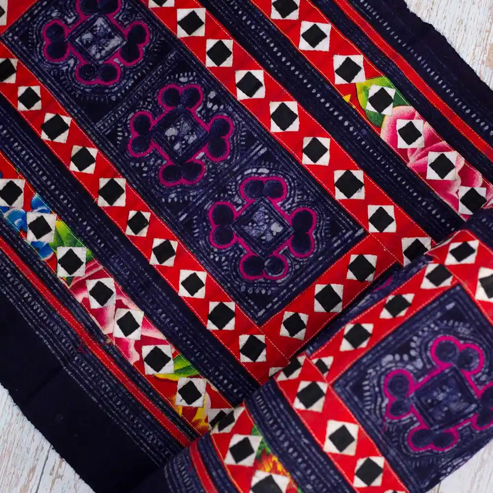 Vindigo black tribal fabric roll close-up with detailed embroidery