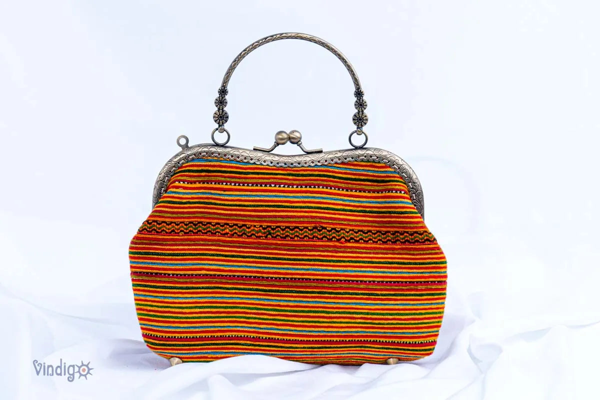 Vindigo striped orange embroidery handbag with copper handle front view