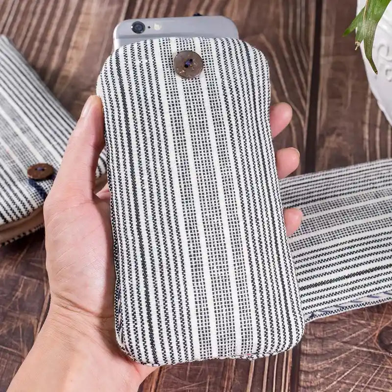 Vindigo striped phone case held in hand vertical view