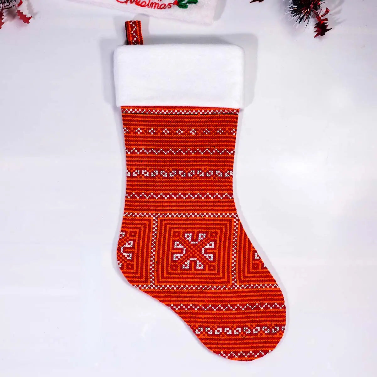 Red stocking with floral Nordic knit pattern front view