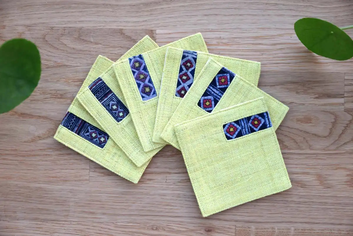 Fan arrangement of Vindigo yellow hemp coasters with indigo fabric
