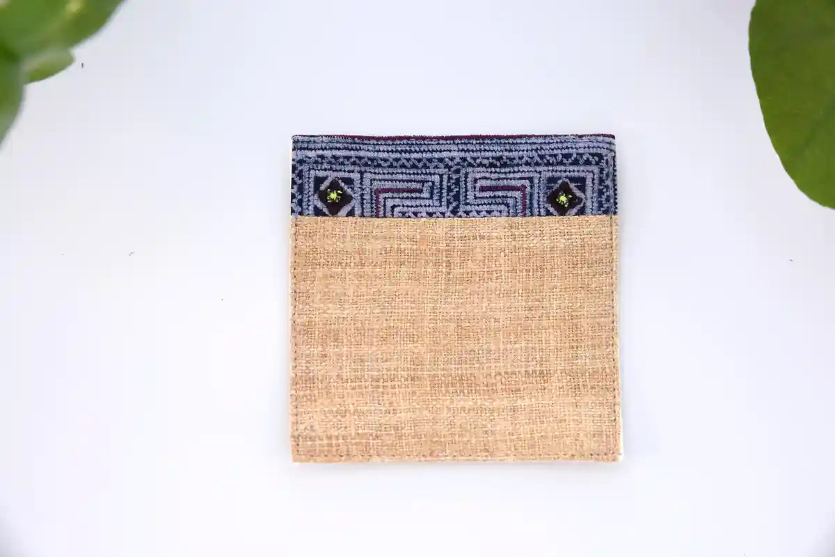 Close-up showing texture of natural hemp coaster with blue accent