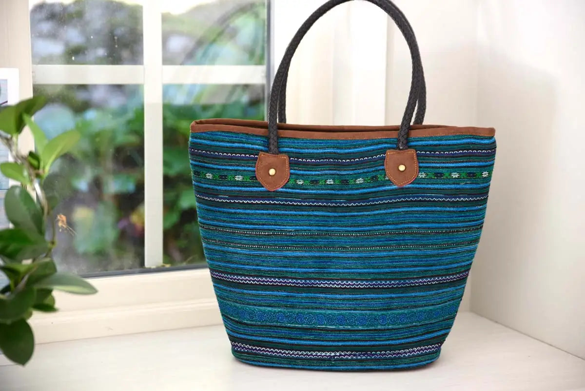 Blue tribal hemp tote bag placed near bright window