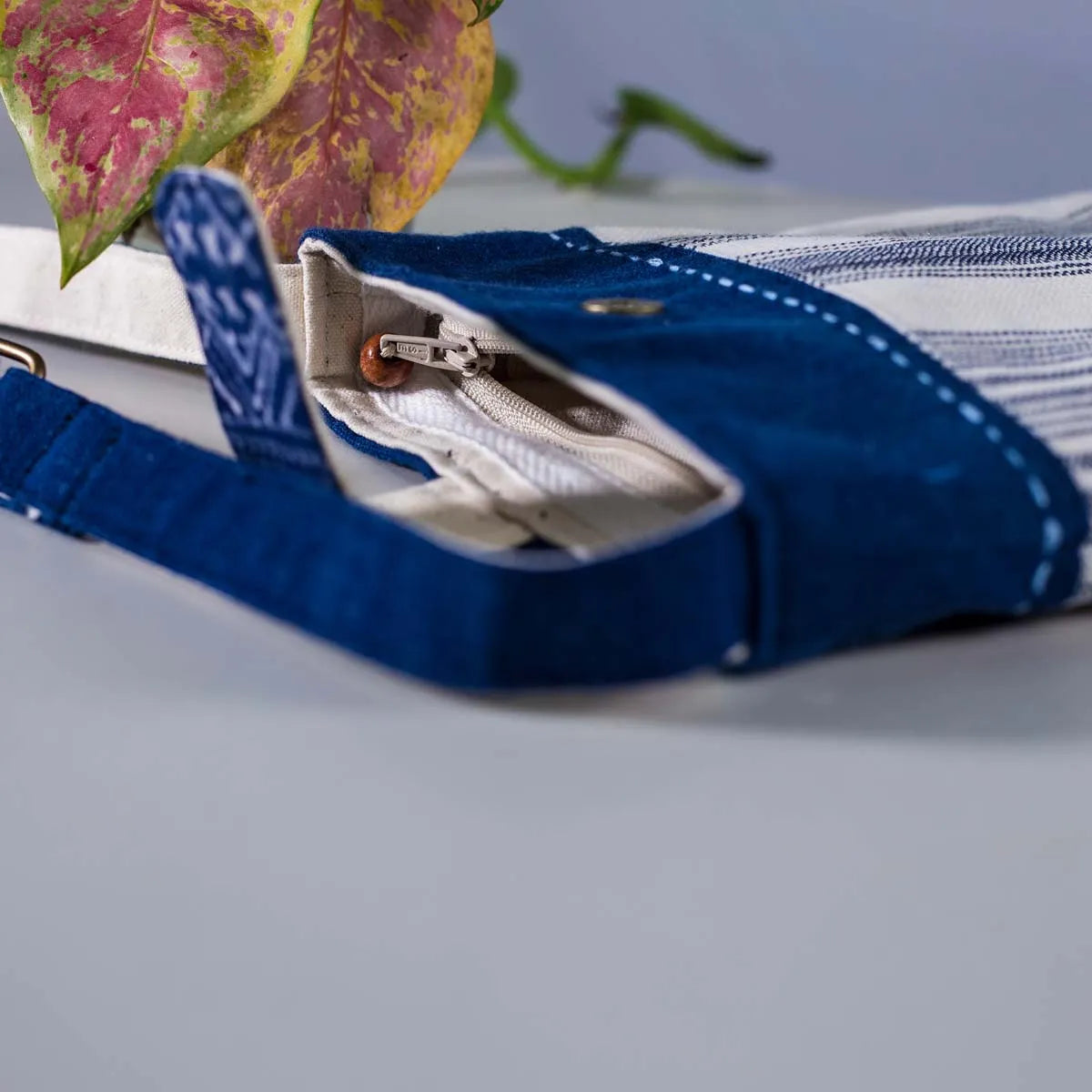 Vindigo striped hemp bag open view showing secure zipper and flap