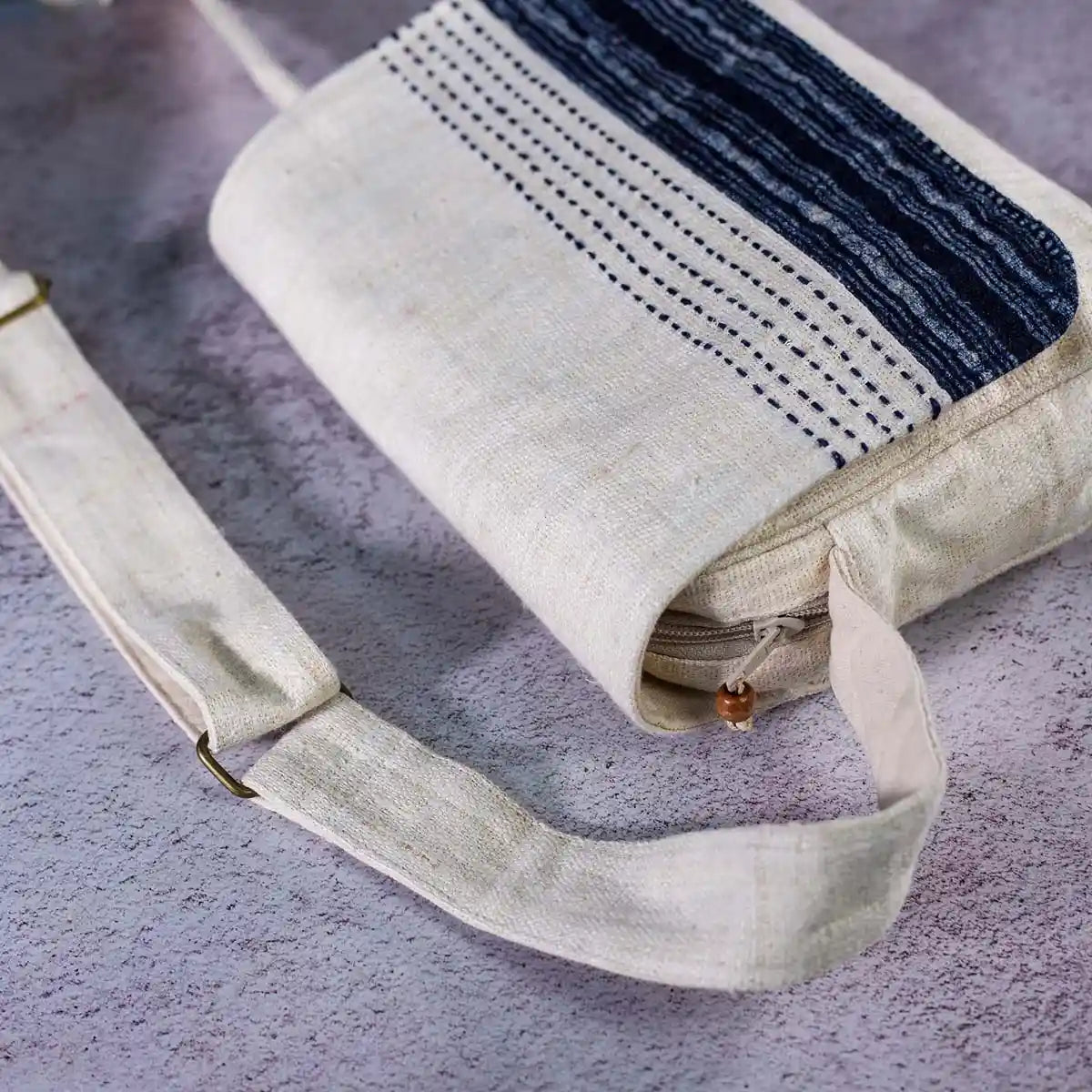 Vindigo crossbody bag close-up of hand-stitched indigo batik flap