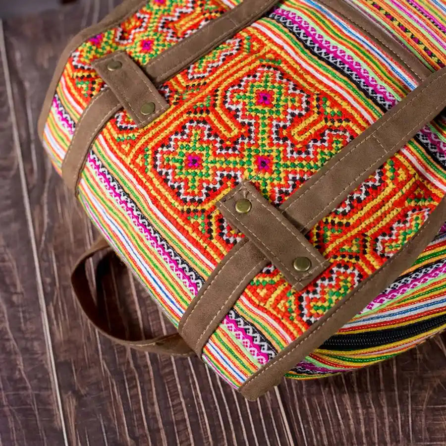 Vindigo orange embroidered cotton backpack close-up detail