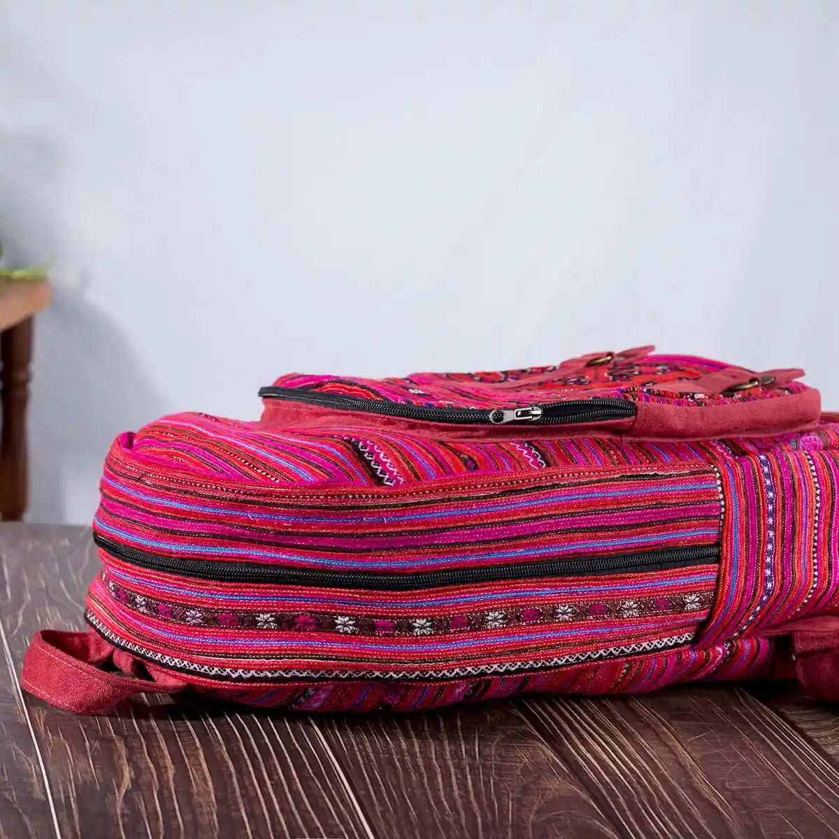 Vindigo pink cotton embroidered backpack angled view
