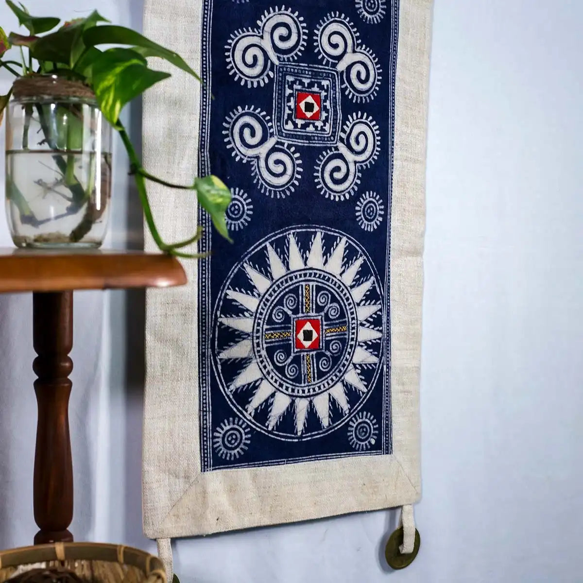 Vindigo indigo hemp batik tapestry beside table and plant