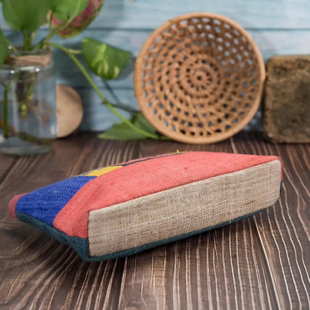 Vindigo hemp cosmetic bag side view with red base and colorful pattern