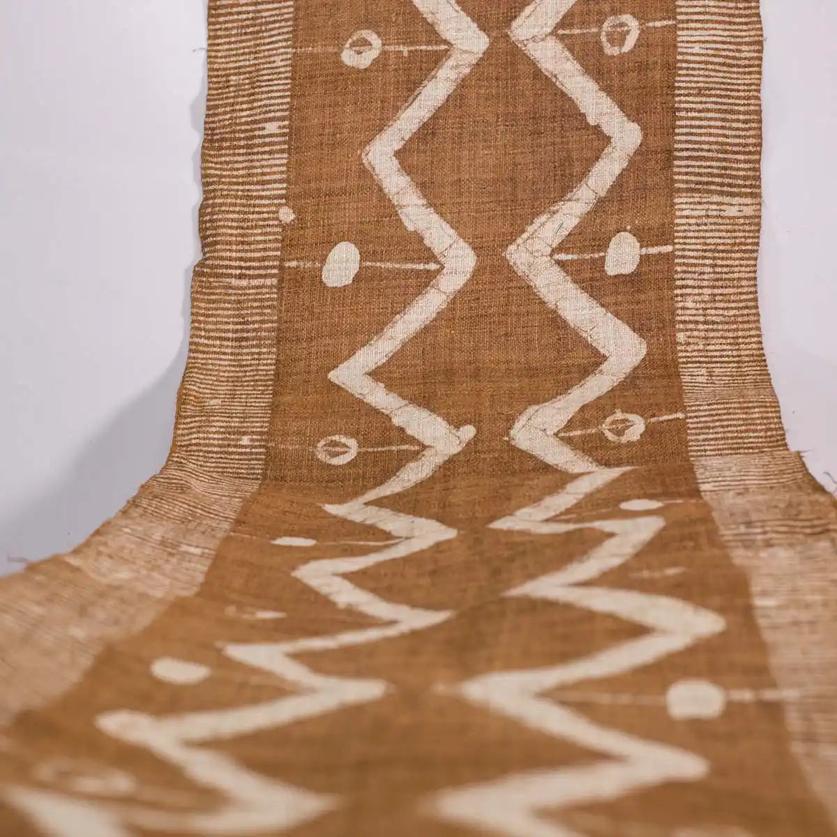 Vindigo brown tribal zigzag fabric roll long top-down view