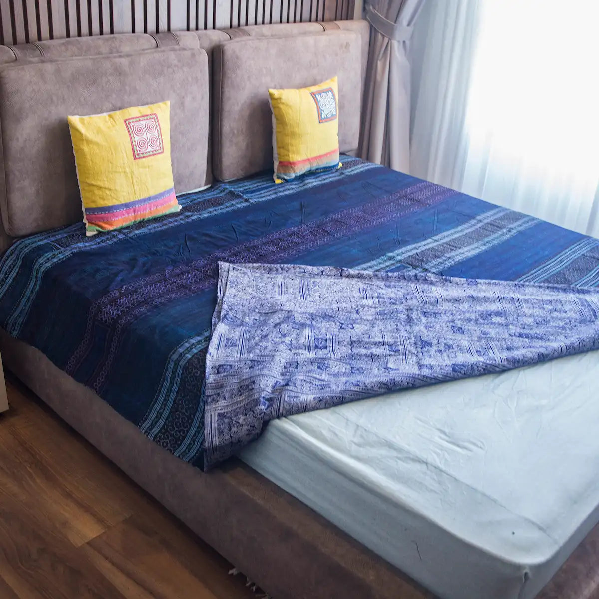 Vindigo indigo cotton bed cover showing both batik and embroidery sides