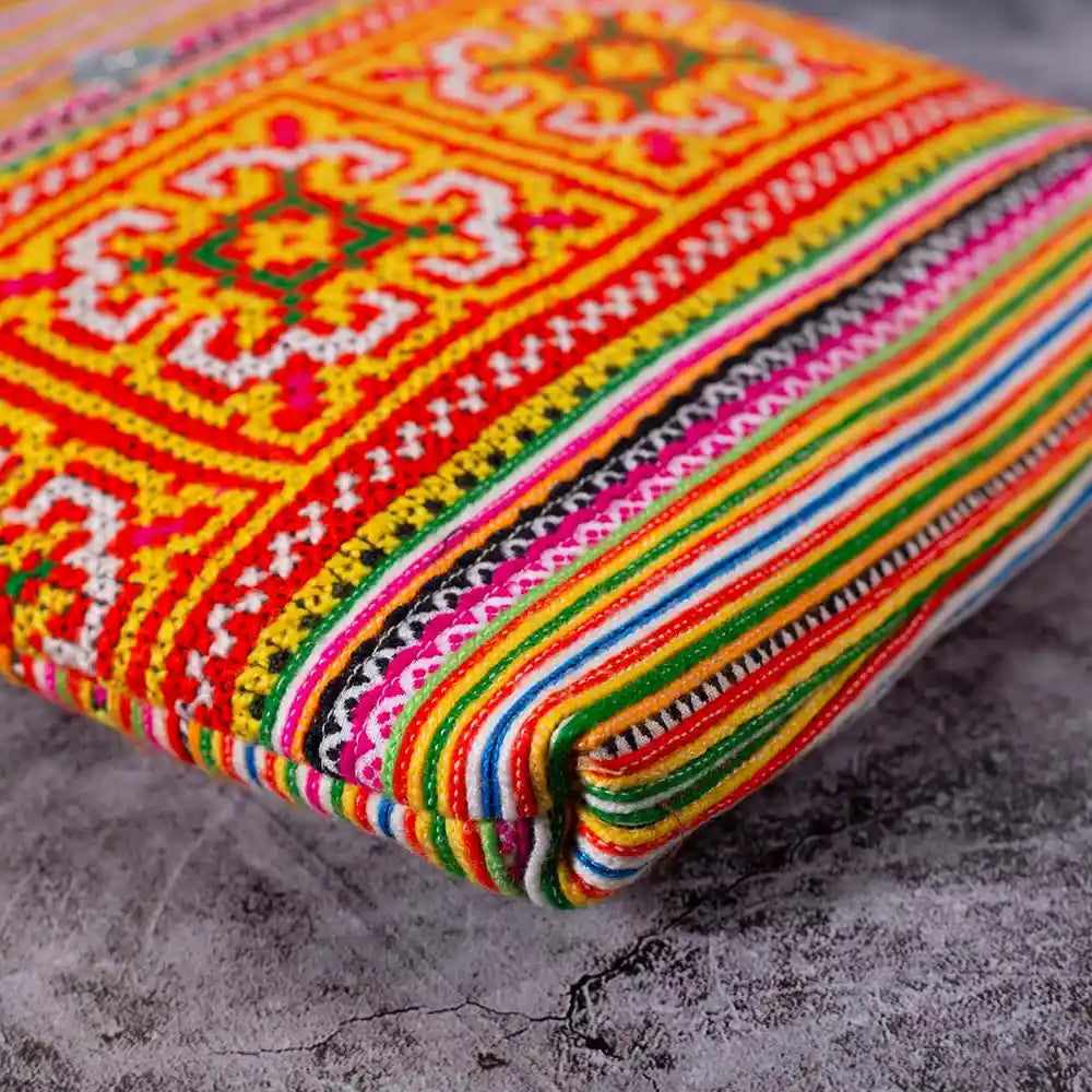 Vindigo hemp crossbody bag bottom view with orange H’mong embroidery patterns