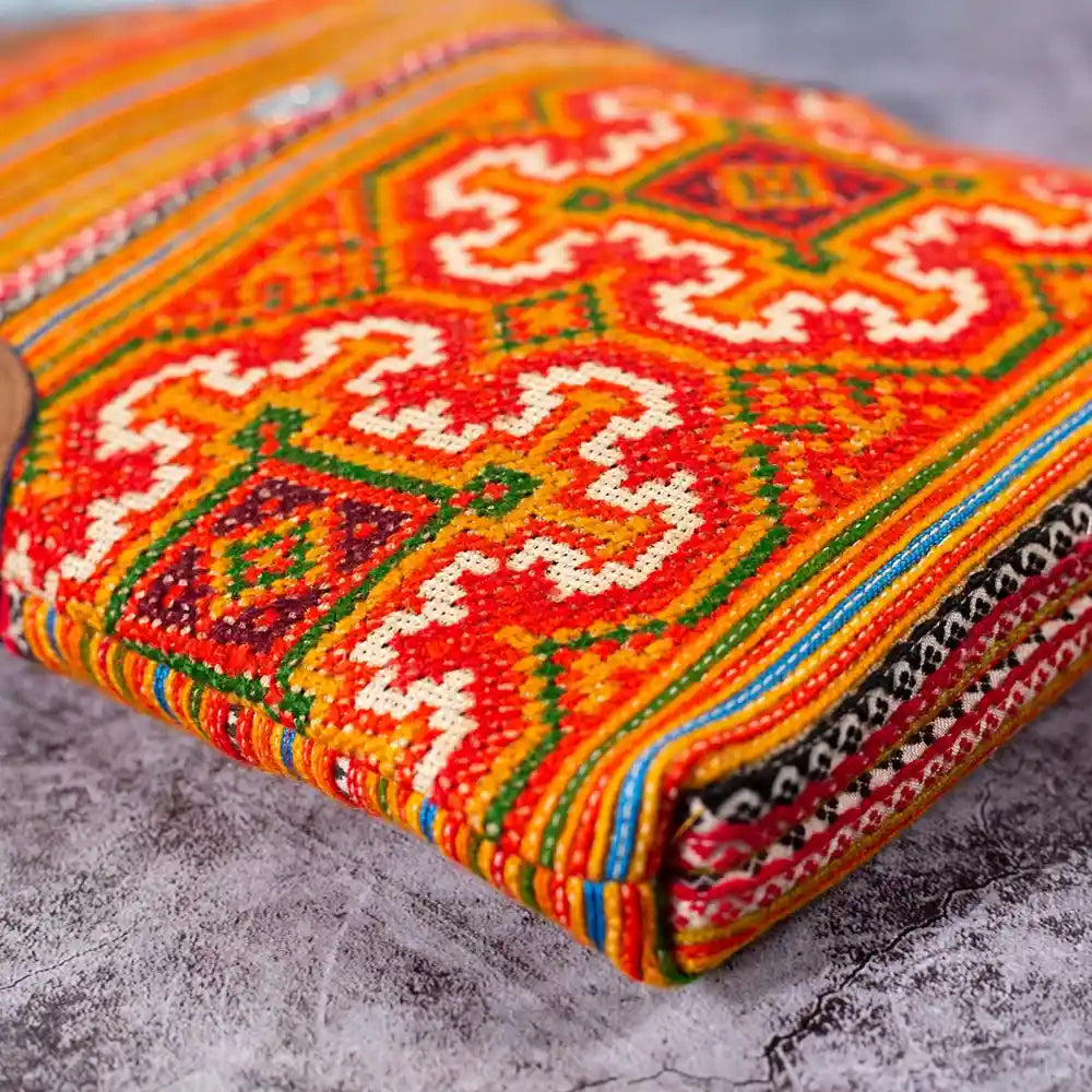 Vindigo hemp crossbody bag bottom view highlighting intricate orange embroidery