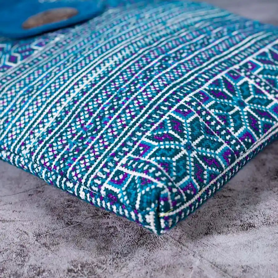 Vindigo blue embroidered crossbody bag bottom view highlighting intricate H’mong pattern